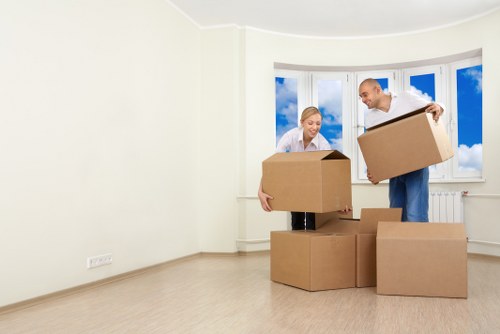 Professional movers handling furniture during a Welling relocation