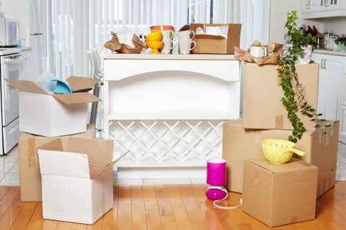 Packed boxes and furniture ready for removal in Welling
