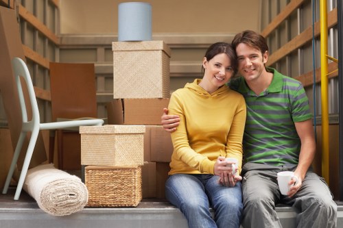 Careful wrapping of fragile household items during a local packing service in Welling
