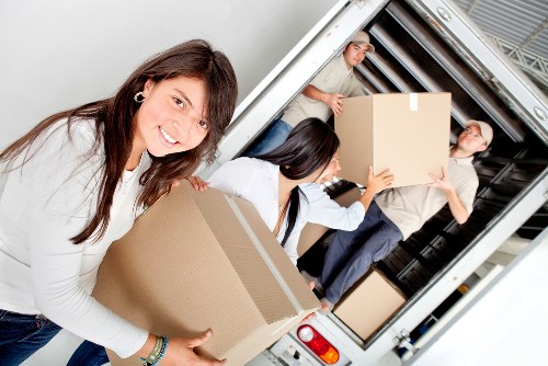 Loading furniture into a removals van in Welling